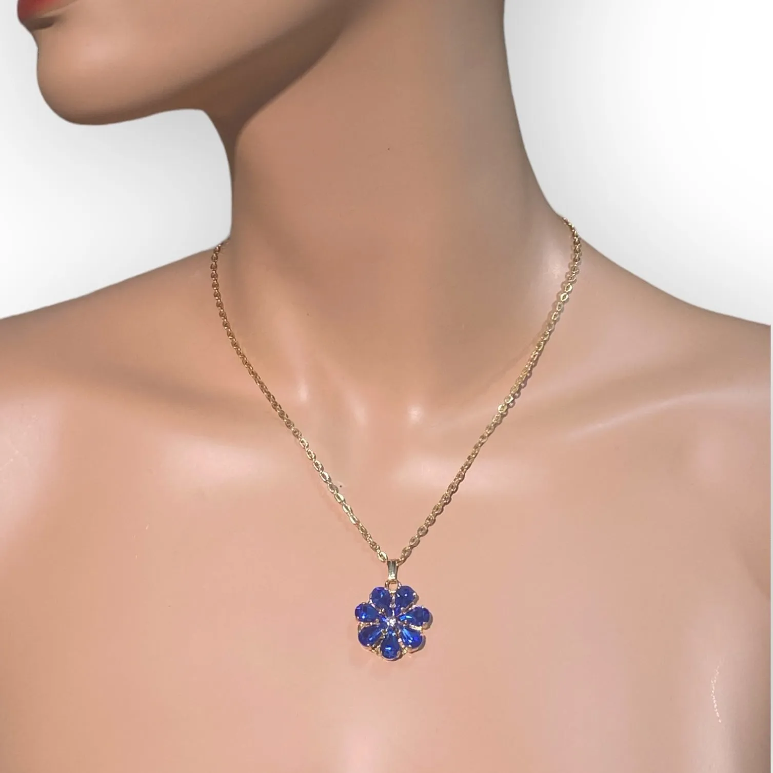 Daisy Pendant Necklace With Crystal Drops In sapphire and aquamarine Shades.